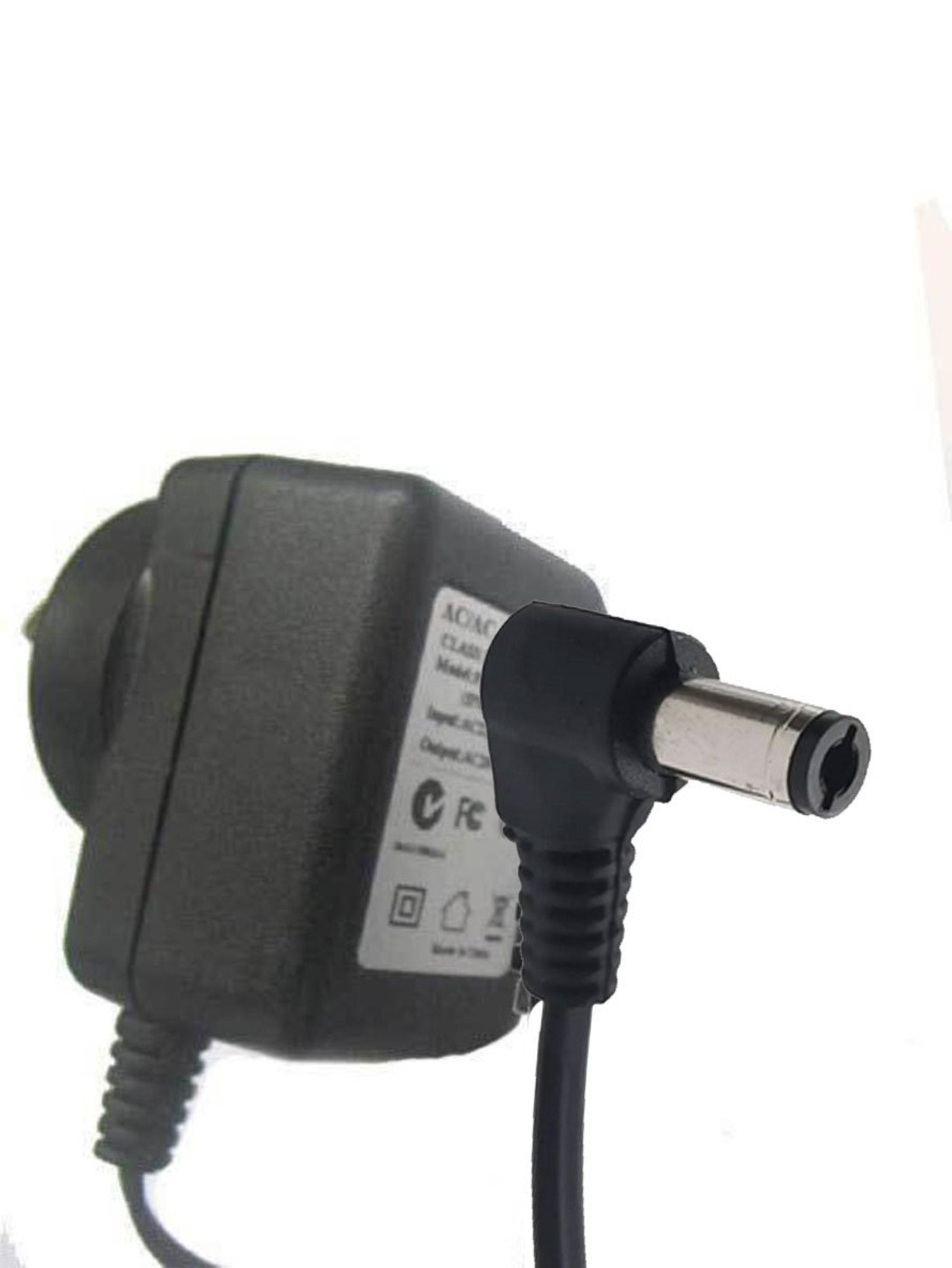 A black power adaptor with a European plug and a cable, designed for use with blood pressure monitors.